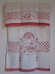 Parade piece
A beautiful old parade piece with handmade red 
embroidery
The parade piece was in the good old days used to 
hang in front of the tea towels so that all things 
always looked clean and beautiful
115cm x 65cm