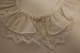 Collar for the child
An old collar made by lace made by hand at the 
edge and with a pearl button, all from the good 
old days
A very beautiful collar from the time when makin 
lace made by hand was looked at with a great 
regard/respect
In good condition