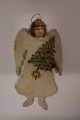 This old Christmas decoration is made of squeezed 
cotton wool and coloured scrap/cardboard
It has a fine old patina