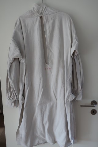 Shift / dress made of flax, with long sleeves
An strong, antique shift with hand made buttonholes, embroidered hand-made 
initials and other items to make the dress beautiful
The antique, Danish linen and fustian is our speciality