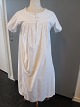 Shift / dressAn old shift with emboidery initials hand made, the old linen buttons, gusset in the seam in the side etc.The antique, Danish linen and fustian is our speciality and we always have a large choice of shifts, babydress etc.