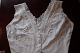 Good old blouse/top without sleeves and with buttons made of fabricVery beautiful and specialThe antique, Danish linen and fustian is our speciality and we always have a large choice of tea towels, table clothes, napkin, clothes etc.