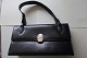 Bag black with a good closing possibility
Inside pockets
L: 23cm
H: 12,5cm
W bottom: 27,5cm
In a good condiion